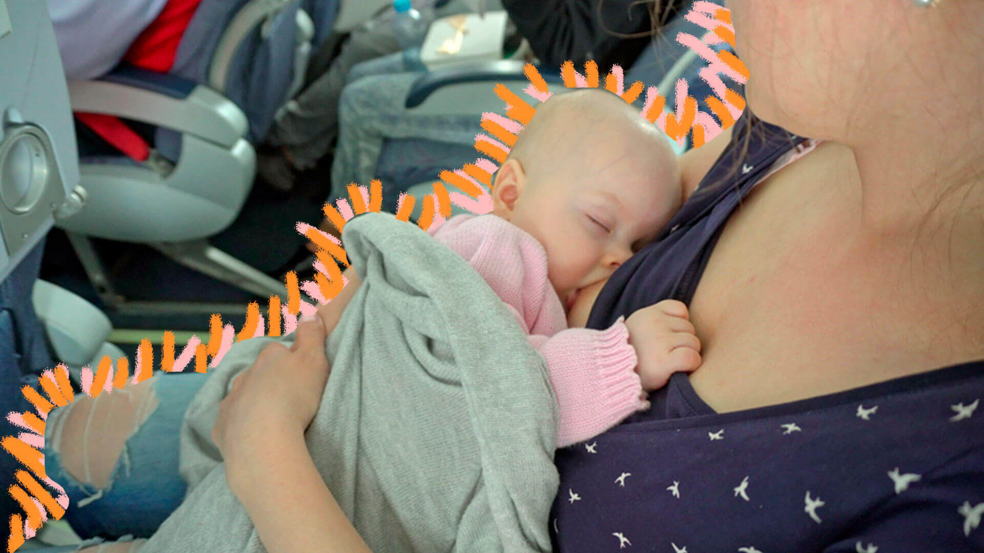 Uma mulher amamenta um bebê sentada em um avião