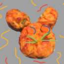 Três bolinhos de bacalhau, em formatos circulares, simulam um coelho com rosto e duas orelhas. A cor dos bolinhos é amarela e é possível notar os ingredientes que vão na receita, como o pimentão vermelho e o cheiro verde.