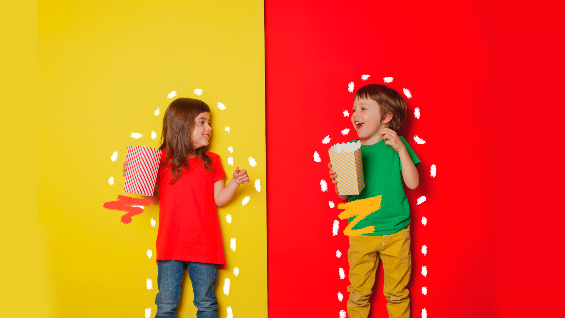 Takorama: duas crianças vestindo roupas muito coloridas e em ujm fundo amarelo e eazul estão de pé, sorrindo e comendo pipoca