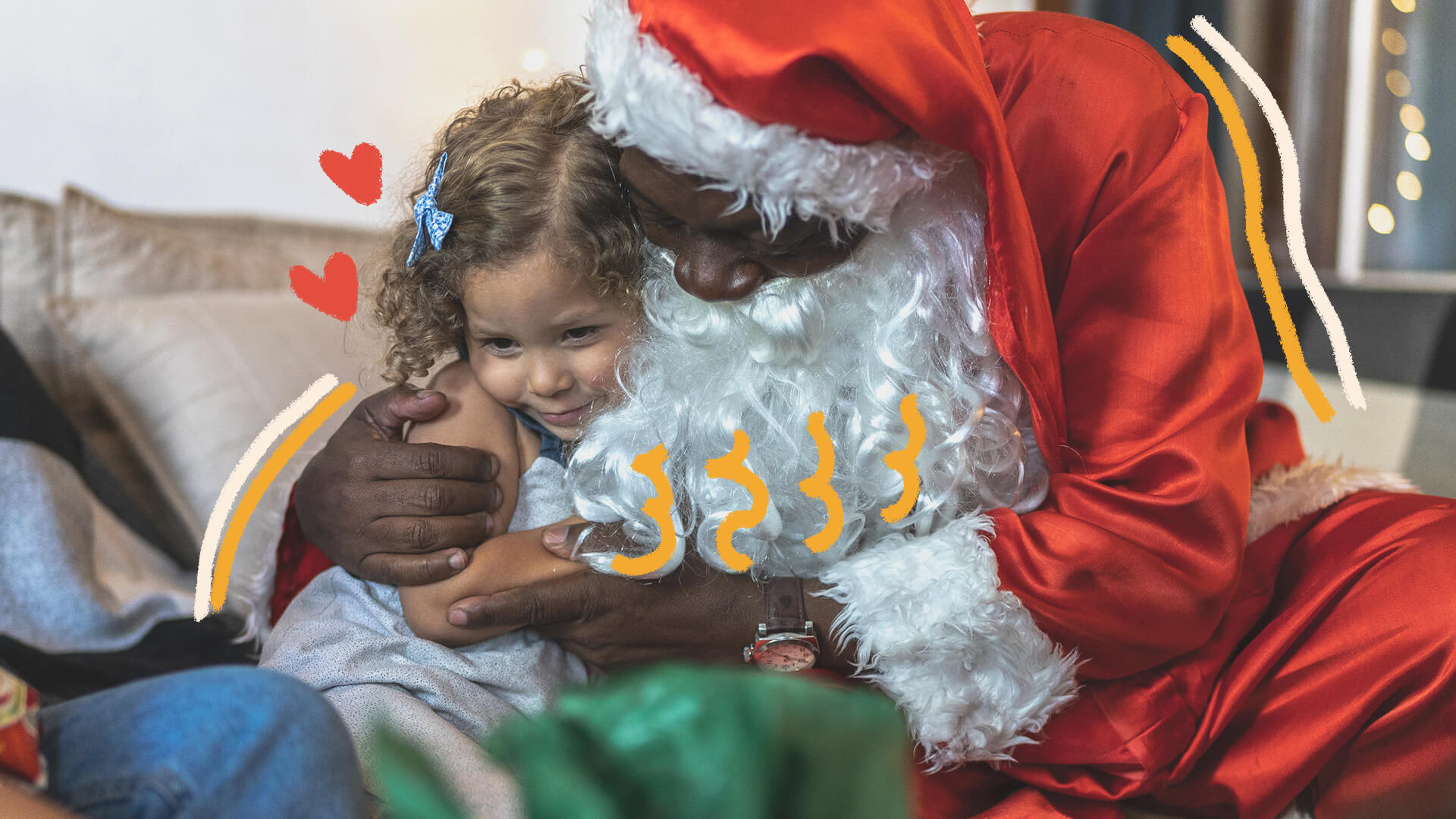 Na foto, uma menina recebe o abraço de um Papai Noel. A imagem possui intervenções de rabiscos coloridos.