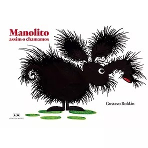 Capa do livro "Manolito, assim o chamamos". Num fundo branco, um bicho peludo preto