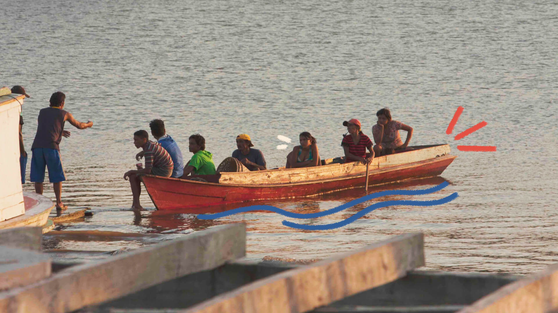 Um grupo de pessoas numa embarcação próxima às margens do rio