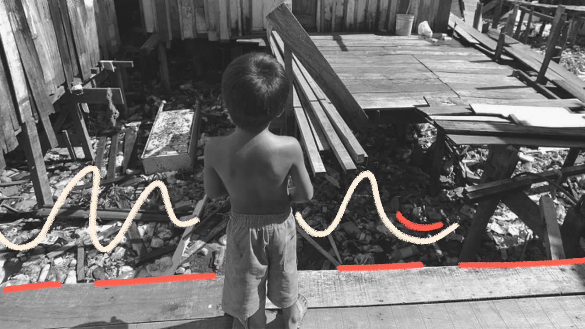 Crianças na pobreza: Imagem em preto e branco de uma criança de costas olhando escombros.