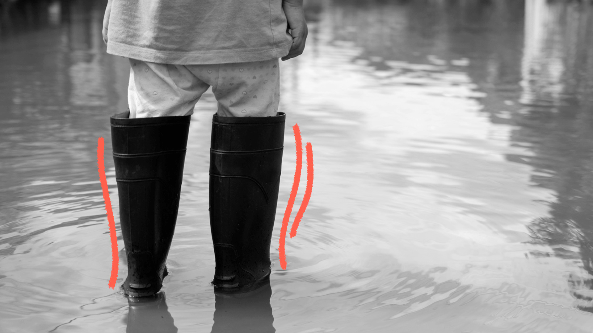 imagem de capa para matéria sobre as chuvas no Rio Grande do Sul mostra em petro e branco uma pessoa de costas, andando de galochas em um local alagado.