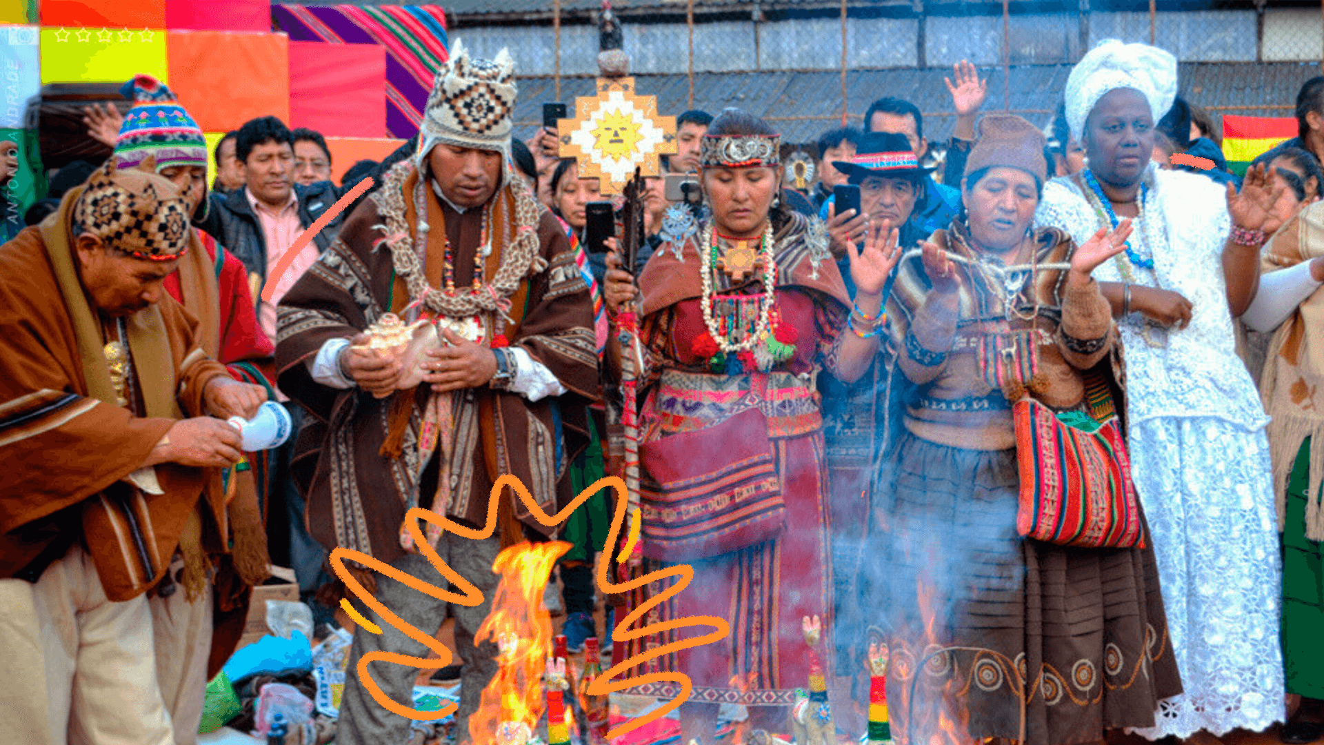 Povos indígenas e africanos celebram festas juninas decoloniais ao redor de uma fogueira.