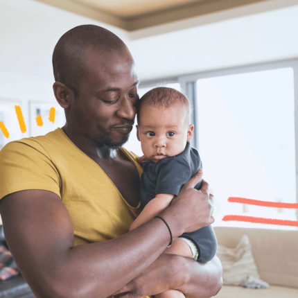 imagem de capa para matéria sobre amor paterno mostra um homem negro segurando um bebê no colo