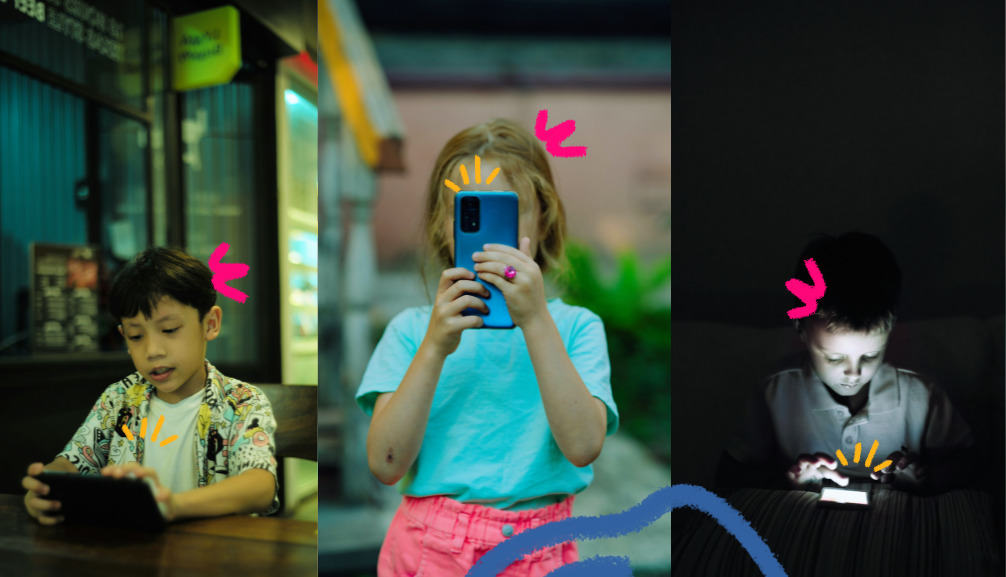Imagem mostra três crianças usando celulares . Uma menina ao cntro e dois meninos nas pontas.