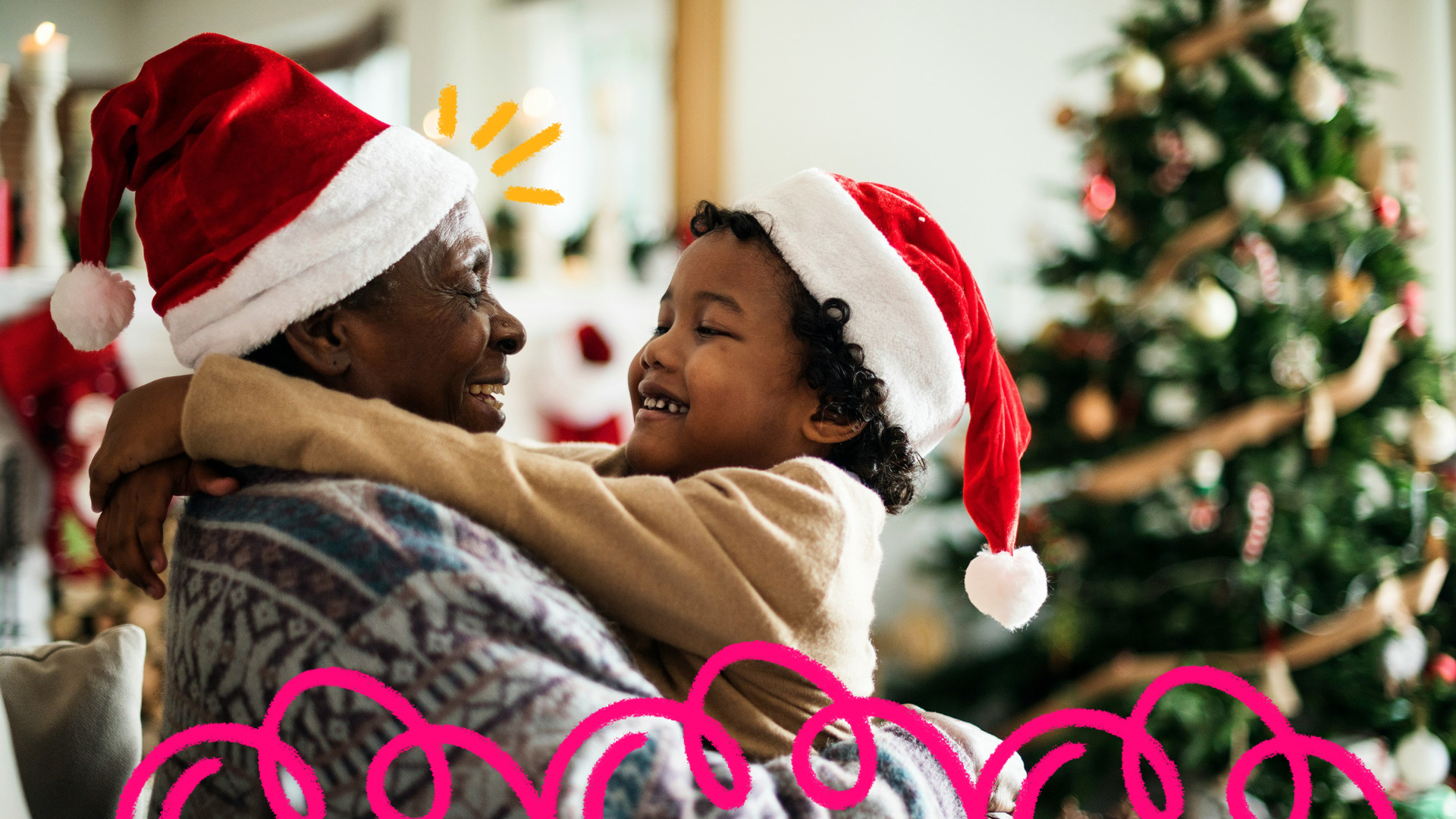 Imagem de capa para matéria sobre brincadeiras de natal mostra uma mulher idosa negra usando gorro de natal segurando no colo um menino negro usando gorro de natal.